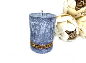 Scented candle decorated with amber