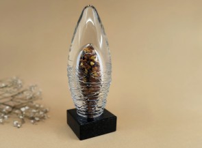 Glass souvenir sculpture with natural amber